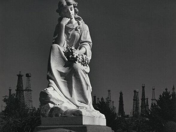 Cemetery Statue and Oil Derricks, Long Beach, California, 1939